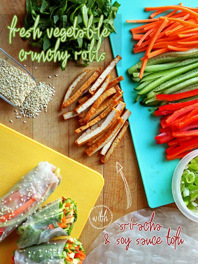 Vegan Rice Paper Rolls shown on a cutting board along with ingredients.