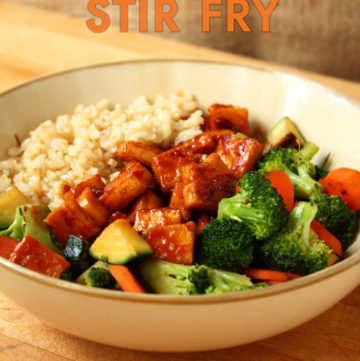 A bowl of Teriyaki Peanut Tofu with Stir-Fried Veggies & Brown Rice.