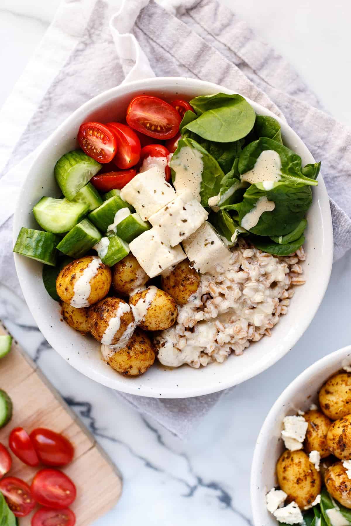 Vegan Mediterranean Bowl on a marble countertop.